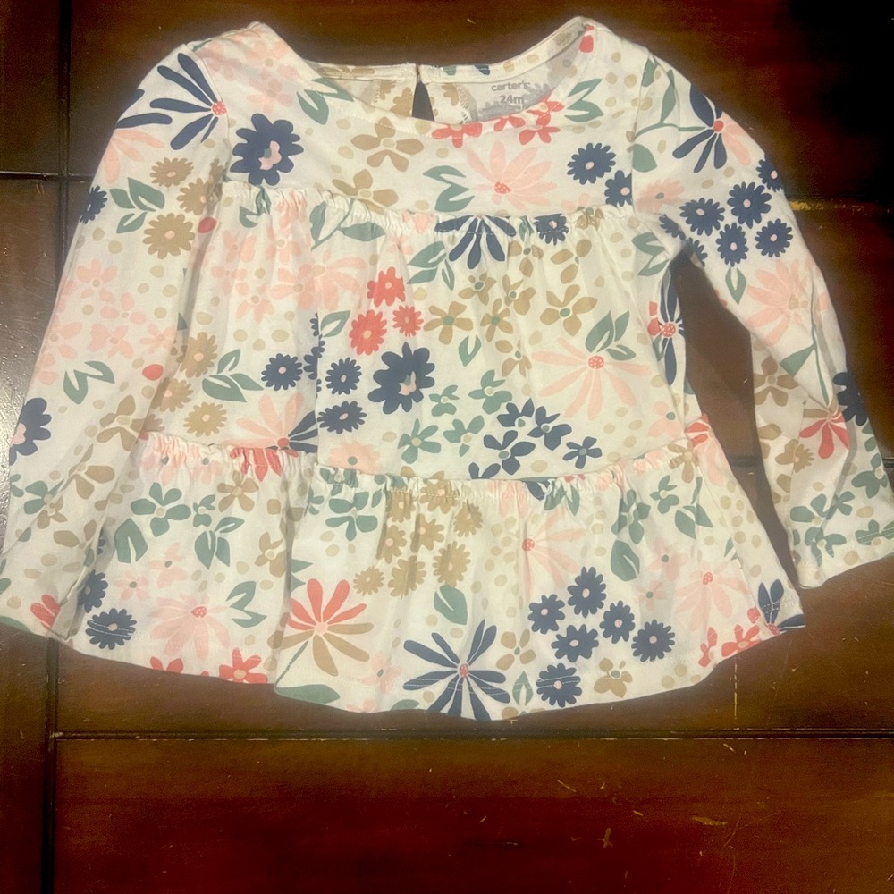 This is a toddler girls floral peplum top. size 24 months.